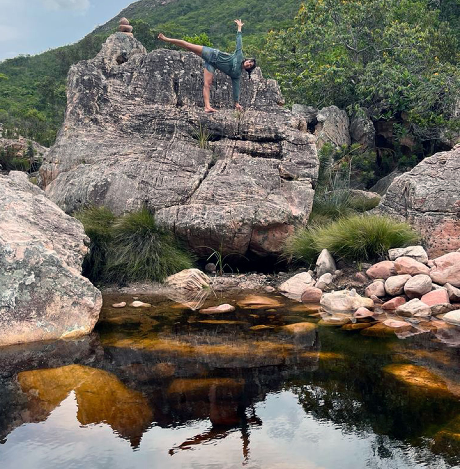 Rosana doing Ardha Chandrasana on rock